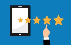 graphic of hand choosing a rating out of five stars on a tablet