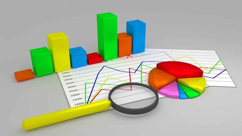 data graphs, charts, and a magnifying glass