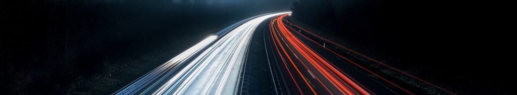 time lapse image of cars on the highway at night