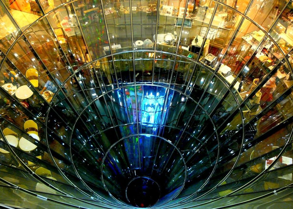 looking down a glass funnel building