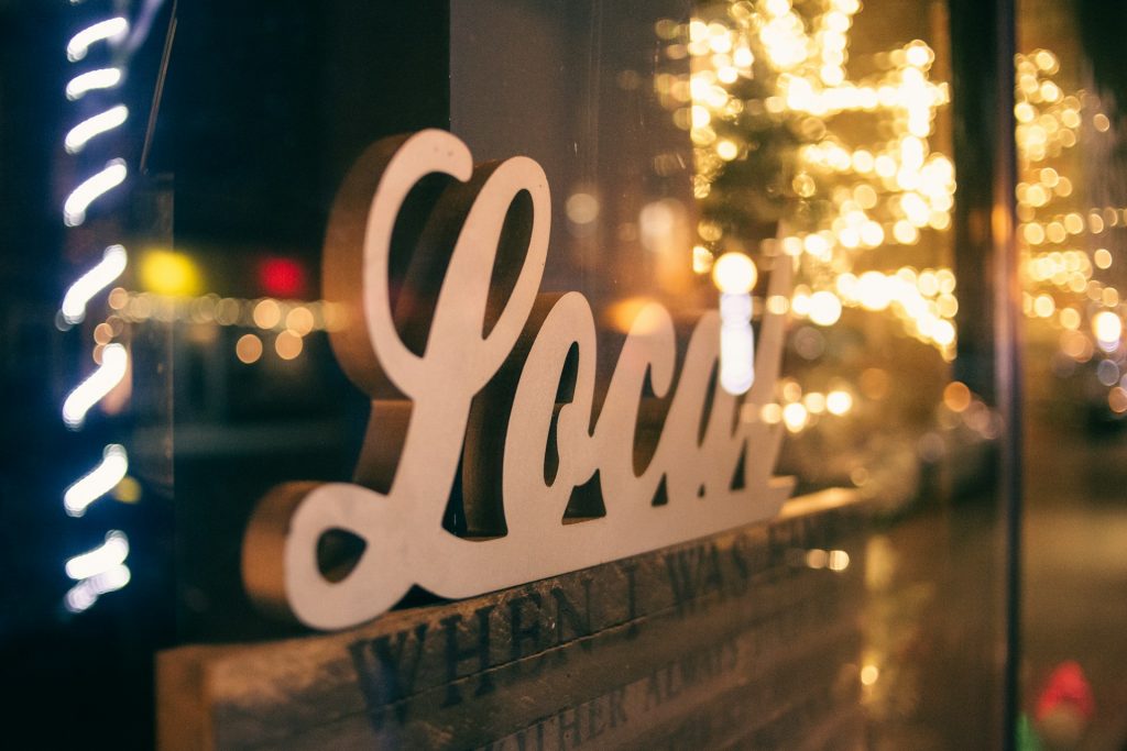 a shop with a "Local" sign in the window