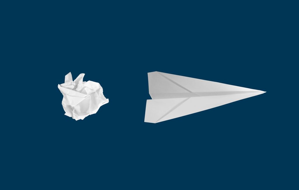 a piece of trash turned into a paper airplane