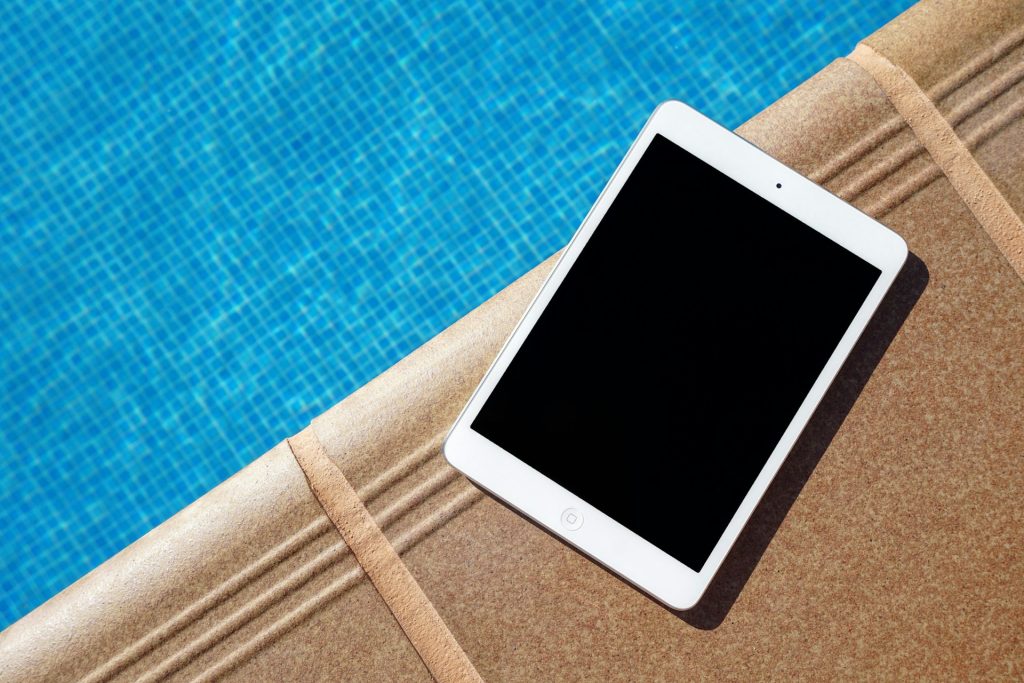a tablet by the pool